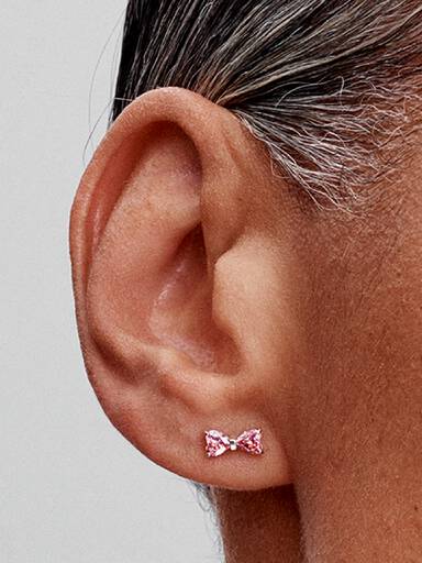 Sprankelende oorknopjes met roze strik