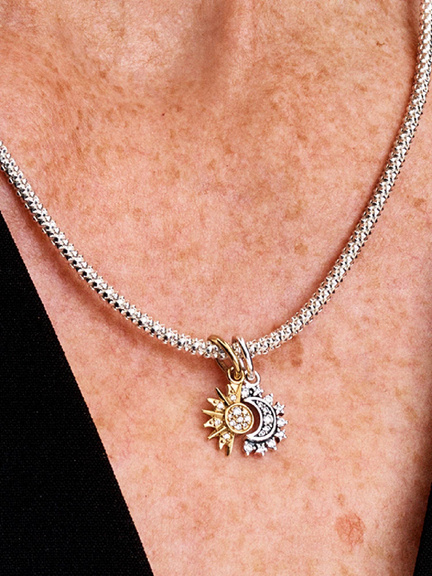 Deelbare hangende bedel met zon en maan